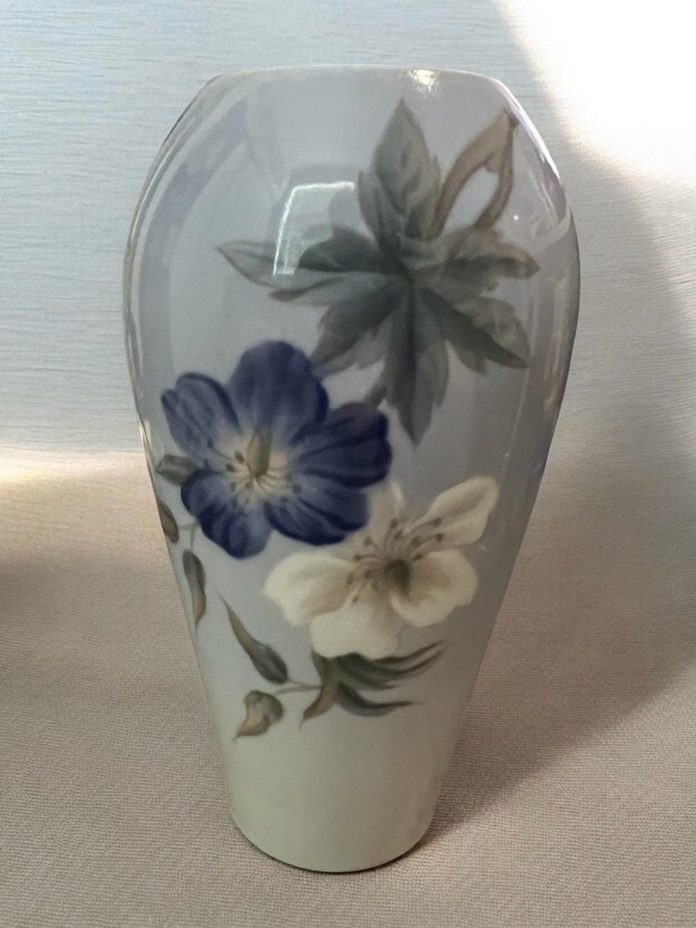 MCM Royal Copenhagen porcelain vase with hand-painted floral motifs.
